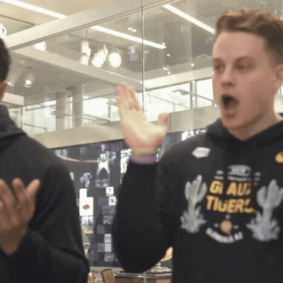 A Man Wearing A Black Sweatshirt That Says Gi Au Tigers GIF