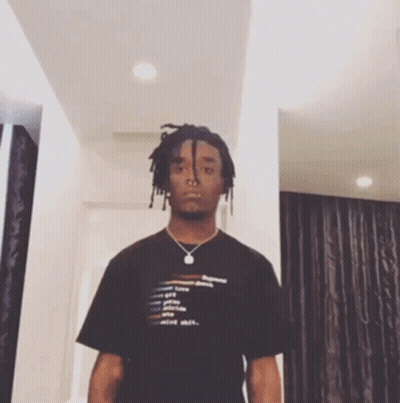 A Man Wearing A Black T-Shirt That Says Mind Shit GIF