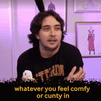 A Man Wearing A Black T-Shirt That Says ' Whatever You Feel Comfy Or Cunty In ' GIF
