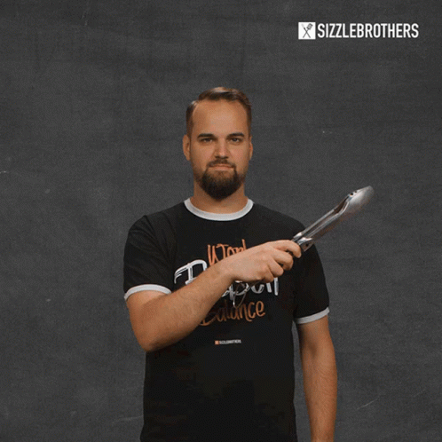 A Man Wearing A Black T-Shirt That Says Work Fleisch Balance GIF