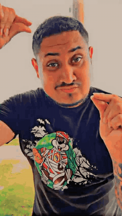 A Man Wearing A Black T-Shirt With A Picture Of A Mummy Bear On It GIF