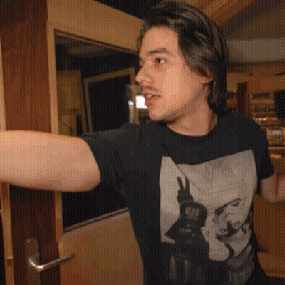A Man Wearing A Black T-Shirt With A Picture Of A Woman On It GIF