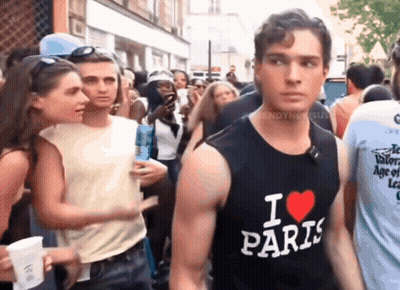 A Man Wearing A Black Tank Top That Says " I Love Paris " GIF