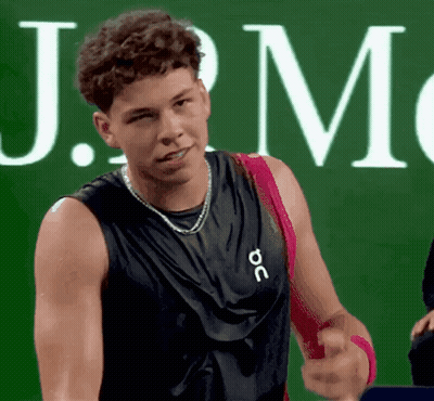 A Man Wearing A Black Tank Top That Says J.m. GIF