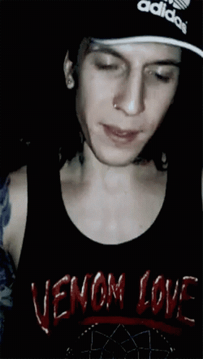 A Man Wearing A Black Tank Top That Says Venom Love On It GIF