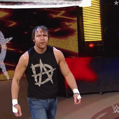 A Man Wearing A Black Tank Top With An Anarchy Symbol GIF