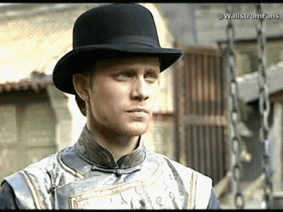 A Man Wearing A Black Top Hat And A Gray Shirt With The Words Wallstromfans Written On The Bottom GIF