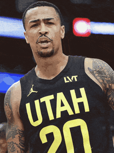 A Man Wearing A Black Utah Jersey With The Number 20 On It GIF