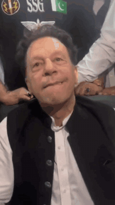 A Man Wearing A Black Vest With The Word Ssg On It Is Making A Face GIF