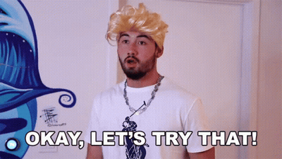 A Man Wearing A Blonde Wig And A White Shirt Says Okay Let 'S Try That GIF