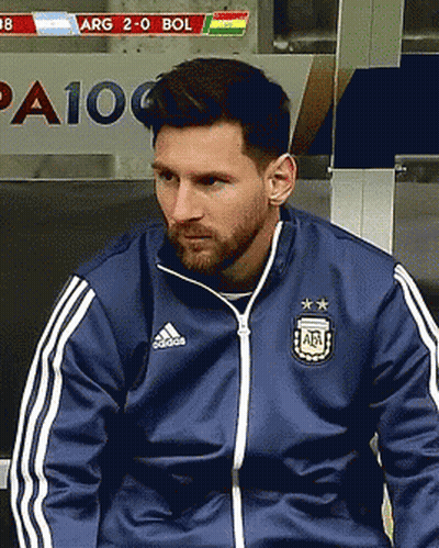 A Man Wearing A Blue Adidas Jacket Sits In A Locker Room GIF
