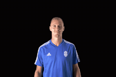 A Man Wearing A Blue Adidas Shirt Is Giving A Thumbs Up GIF