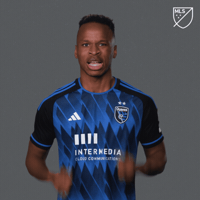 A Man Wearing A Blue And Black Jersey With The Words Let 'S Go On It GIF