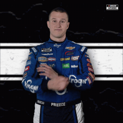 A Man Wearing A Blue And Black Racing Suit With The Name Prieece On It GIF