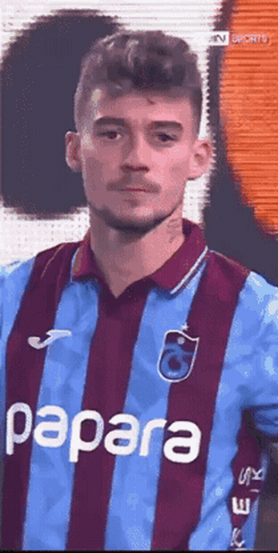 A Man Wearing A Blue And Purple Striped Shirt With Papara On It GIF