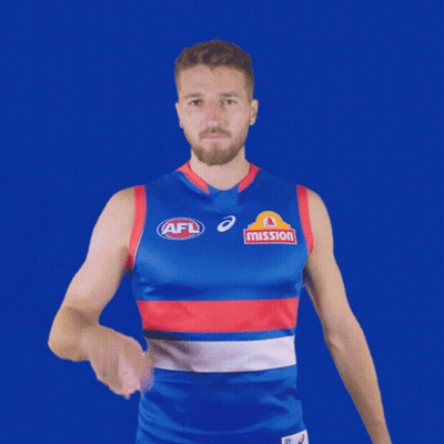 A Man Wearing A Blue And Red Afl Jersey Holds Up His Finger GIF