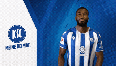 A Man Wearing A Blue And White Striped Shirt With Ksc Meine Heimat On The Bottom GIF