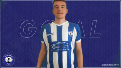 A Man Wearing A Blue And White Striped Shirt With The Word Goal In White Letters GIF