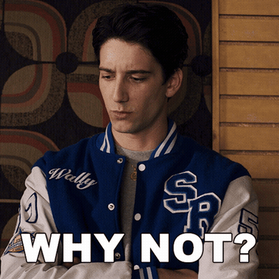 A Man Wearing A Blue And White Varsity Jacket With The Words Why Not On It GIF