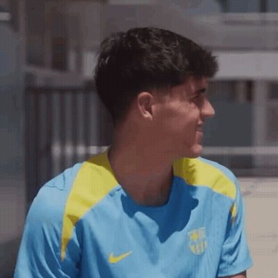 A Man Wearing A Blue And Yellow Nike Shirt Looks To The Side GIF