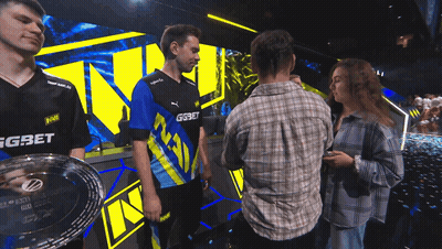 A Man Wearing A Blue And Yellow Shirt With Gg On It GIF