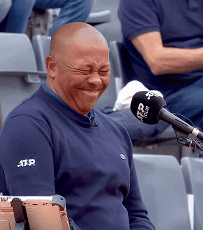 A Man Wearing A Blue Atp Shirt Is Laughing GIF