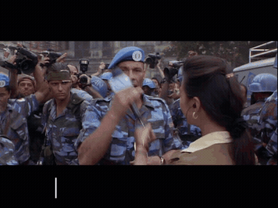 A Man Wearing A Blue Beret With The Number 10 On It GIF