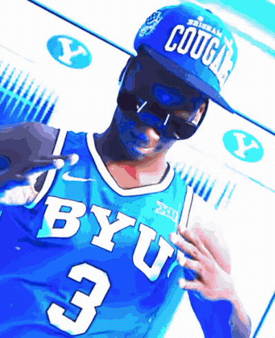 A Man Wearing A Blue Byu Jersey And A Blue Cougars Hat GIF