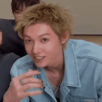 A Man Wearing A Blue Denim Jacket Has A Ring In His Finger GIF