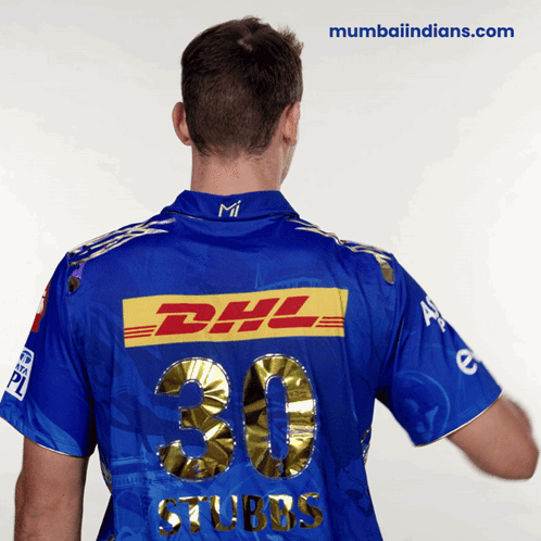 A Man Wearing A Blue Dhl Shirt With The Number 30 On It GIF