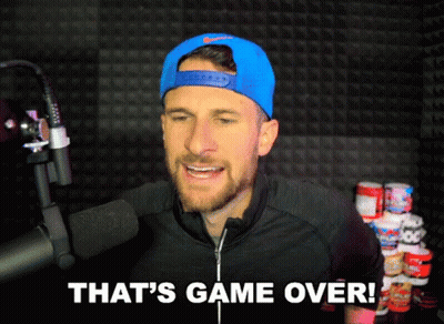 A Man Wearing A Blue Hat And A Black Jacket Says That 'S Game Over GIF