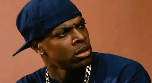 A Man Wearing A Blue Hat And A Blue Shirt Is Looking At The Camera . GIF