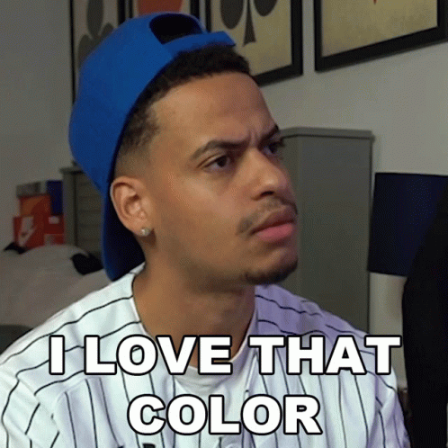 A Man Wearing A Blue Hat And A Striped Shirt Says " I Love That Color " GIF