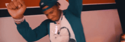 A Man Wearing A Blue Hat And A White Shirt Is Dancing . GIF