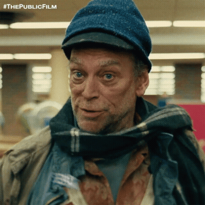 A Man Wearing A Blue Hat And Scarf Has The Publicfilm Written On The Bottom GIF