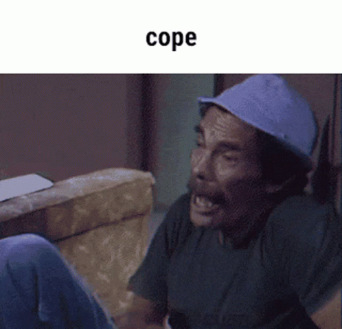 A Man Wearing A Blue Hat Is Sitting On A Couch With The Word Cope Written Above Him GIF