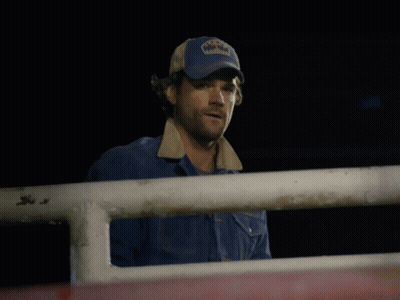A Man Wearing A Blue Hat That Says Texas On It GIF