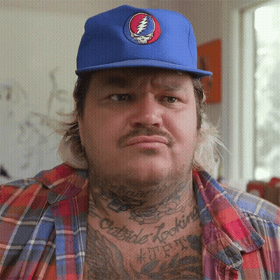 A Man Wearing A Blue Hat With A Grateful Dead Logo GIF