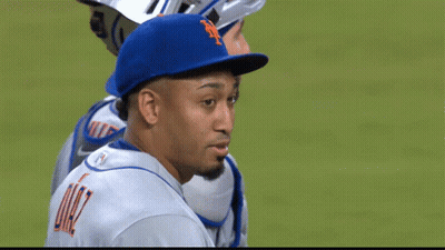 A Man Wearing A Blue Hat With The Letter N On It GIF