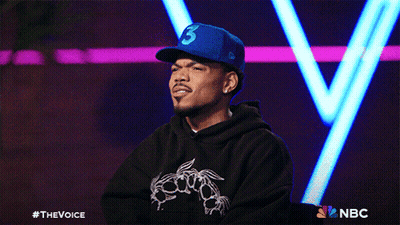 A Man Wearing A Blue Hat With The Number Three On It GIF