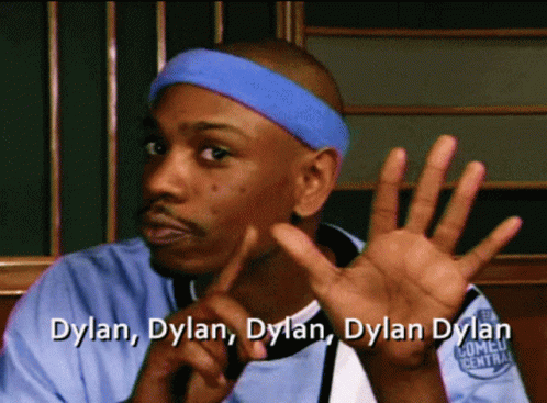 A Man Wearing A Blue Headband With The Name Dylan Written On It GIF