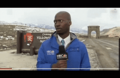 A Man Wearing A Blue Jacket That Says Nbc Montana Holds A Microphone GIF