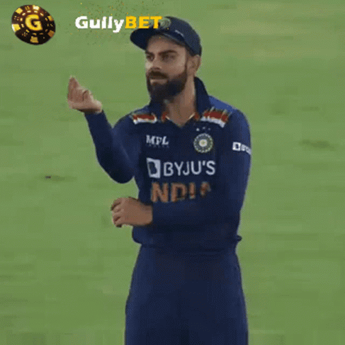 A Man Wearing A Blue Jersey That Says Byju 'S India GIF