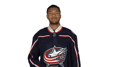 A Man Wearing A Blue Jersey With A Red White And Blue Star Sticker