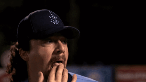 A Man Wearing A Blue Jersey With The Letter A On It Is Giving A Thumbs Up GIF