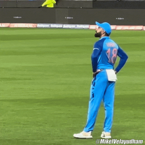 A Man Wearing A Blue Jersey With The Number 18 On It GIF