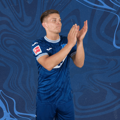 A Man Wearing A Blue Jersey With The Number 5 On It Applauds GIF