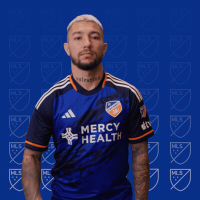 A Man Wearing A Blue Mercy Health Jersey GIF