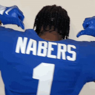 A Man Wearing A Blue Nabers Jersey With The Number 1 On It GIF
