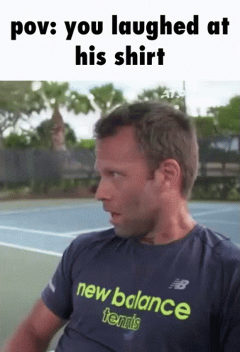 A Man Wearing A Blue New Balance Tennis Shirt GIF